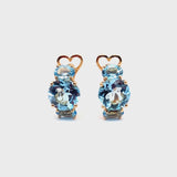 Back to Origin earrings with light blue topaz
