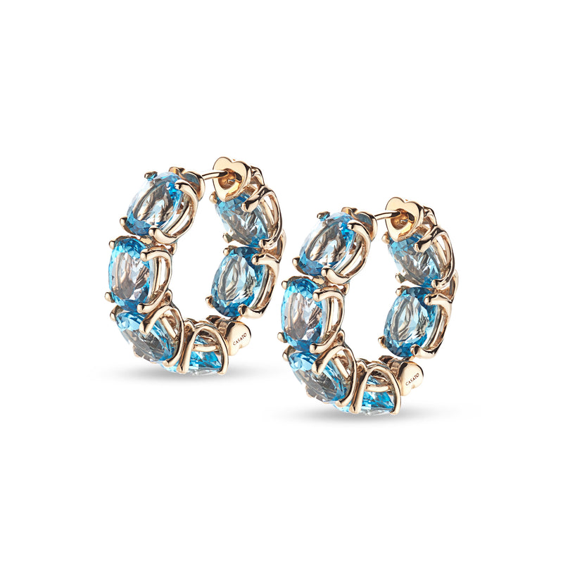 Back to Origin earrings with light blue topaz