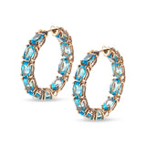 Back to Origin earrings with light blue topaz