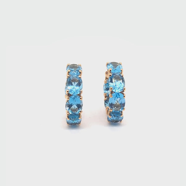 Back to Origin earrings with light blue topaz